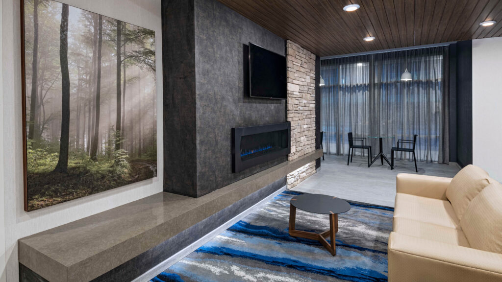 hotel lobby with couch and fireplace