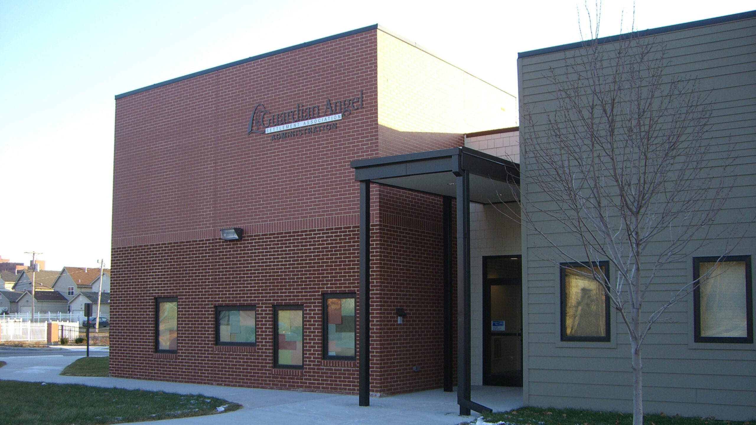 Brick preschool building with entryway and windows