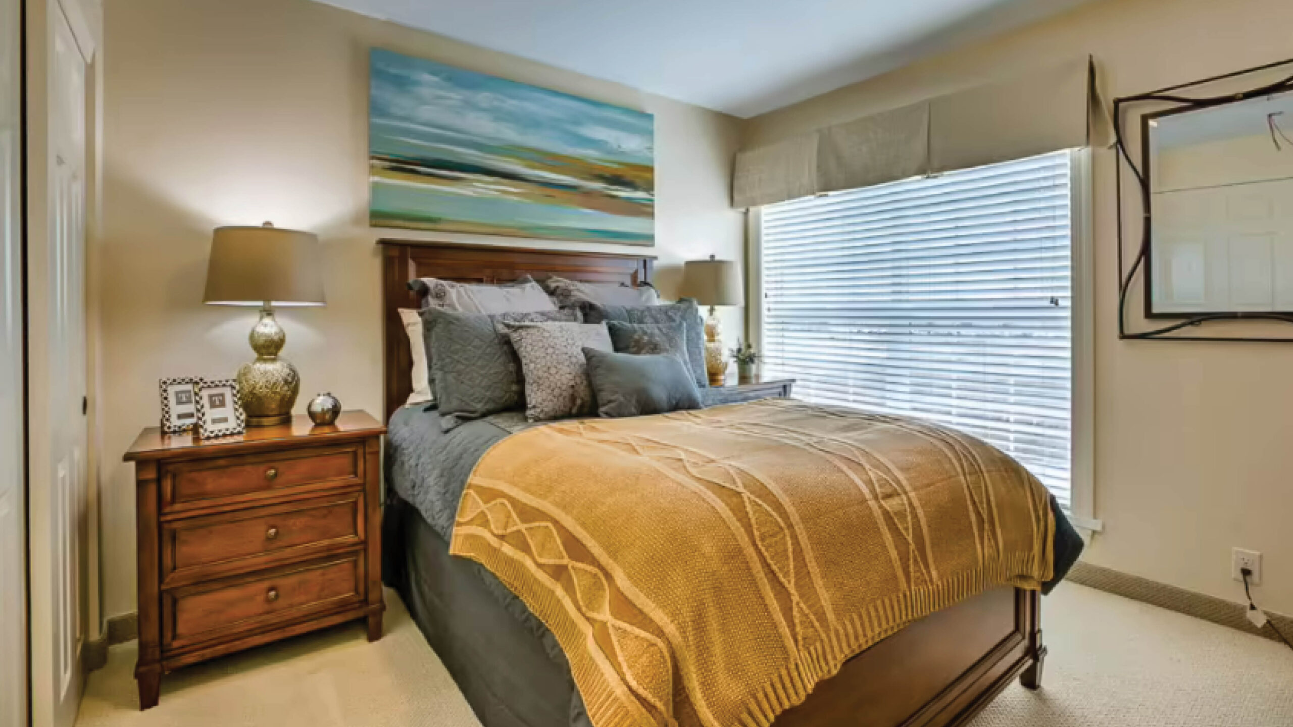 bedroom with queen bed and nightstand