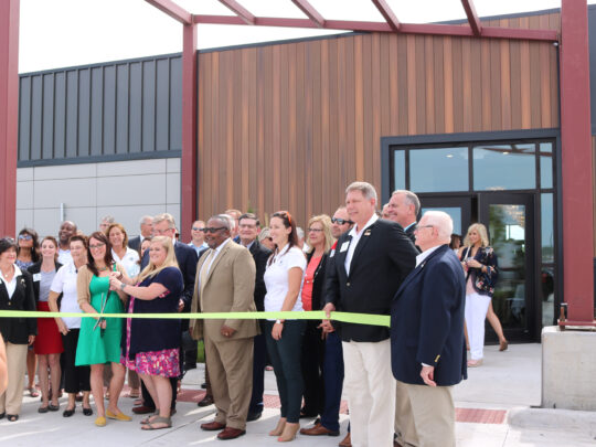 Photo of ribbon cutting at The Bend Event Center.