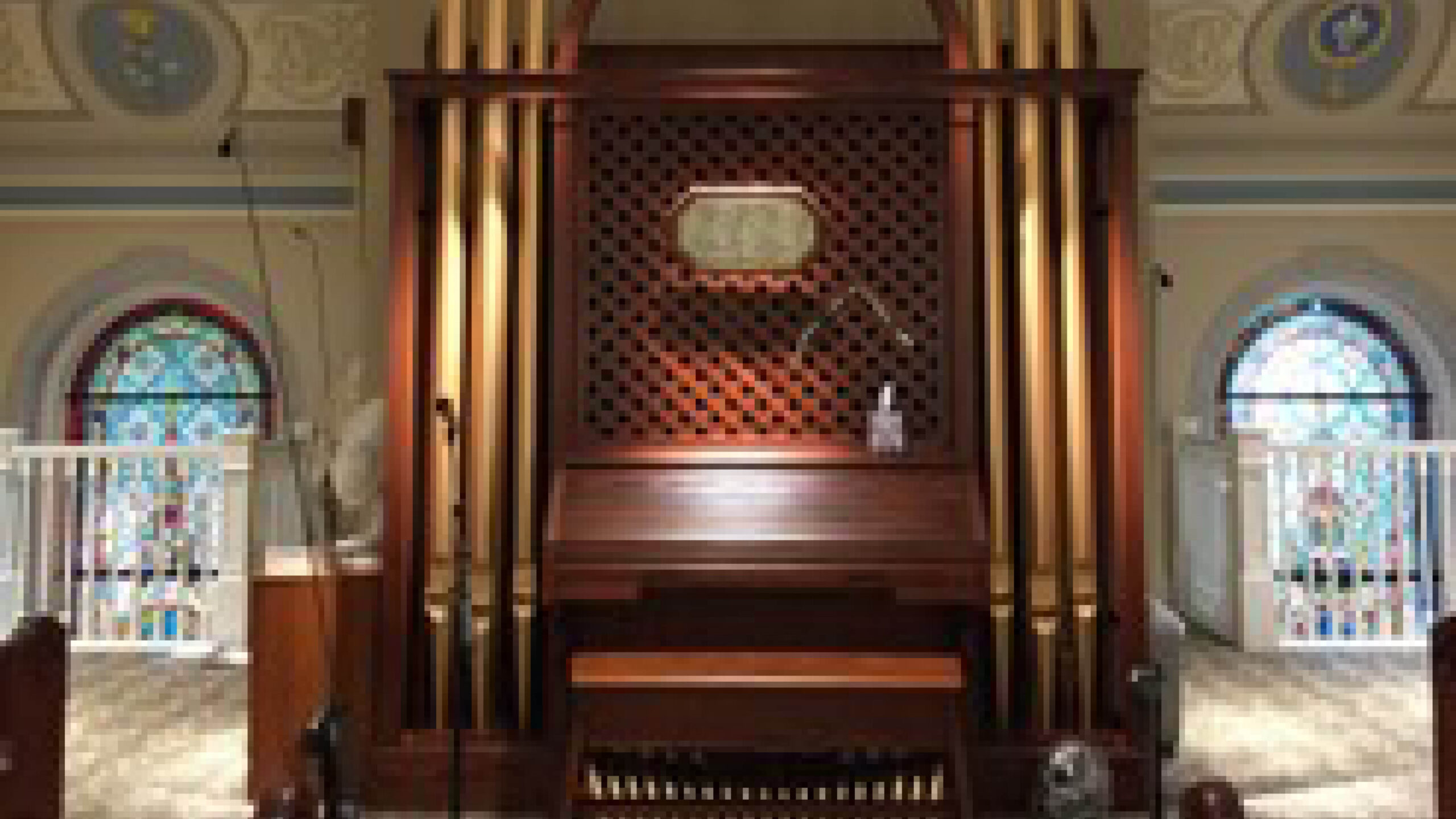 an wood organ with a bench