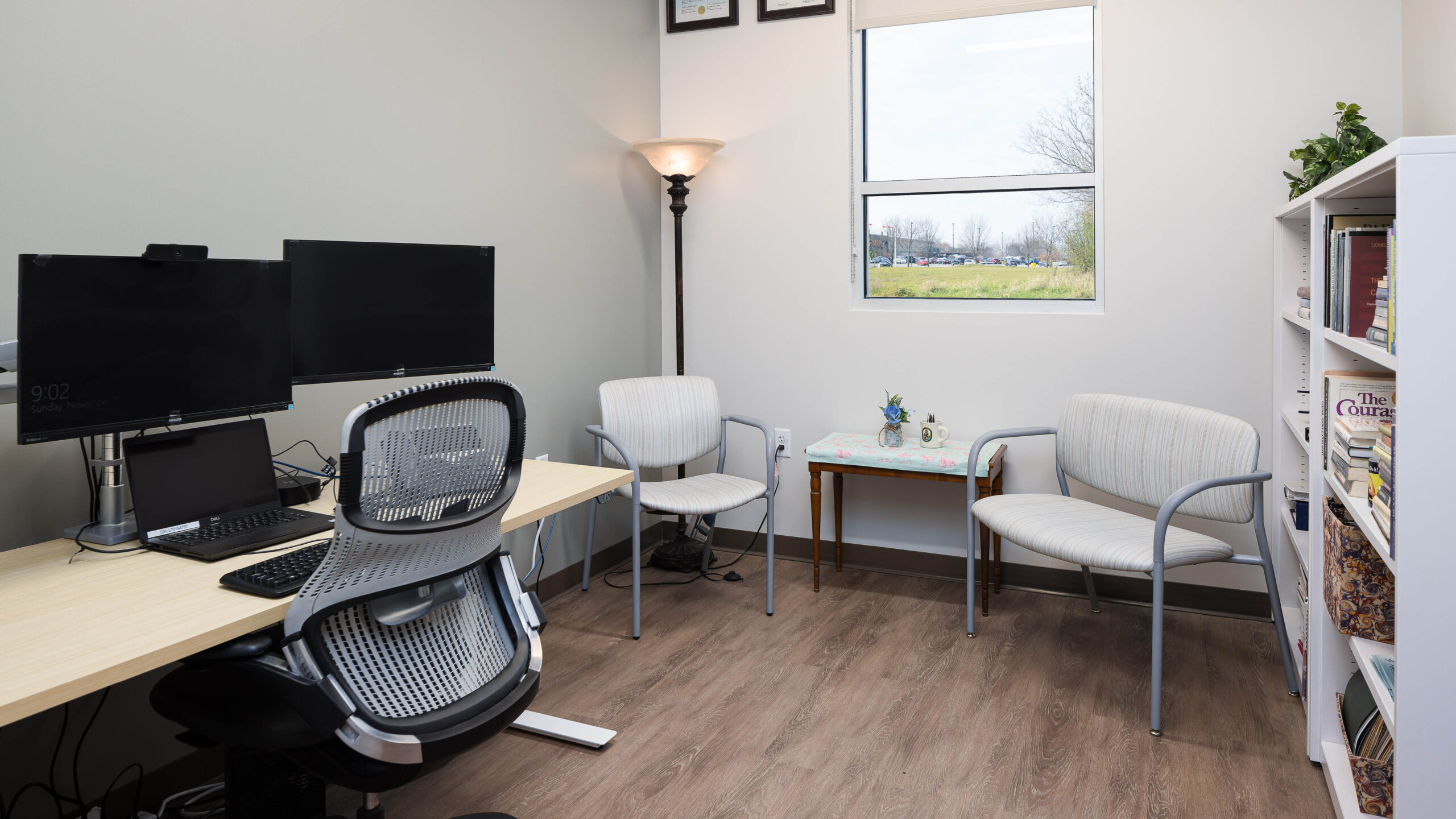 Patient room with desk and chairs