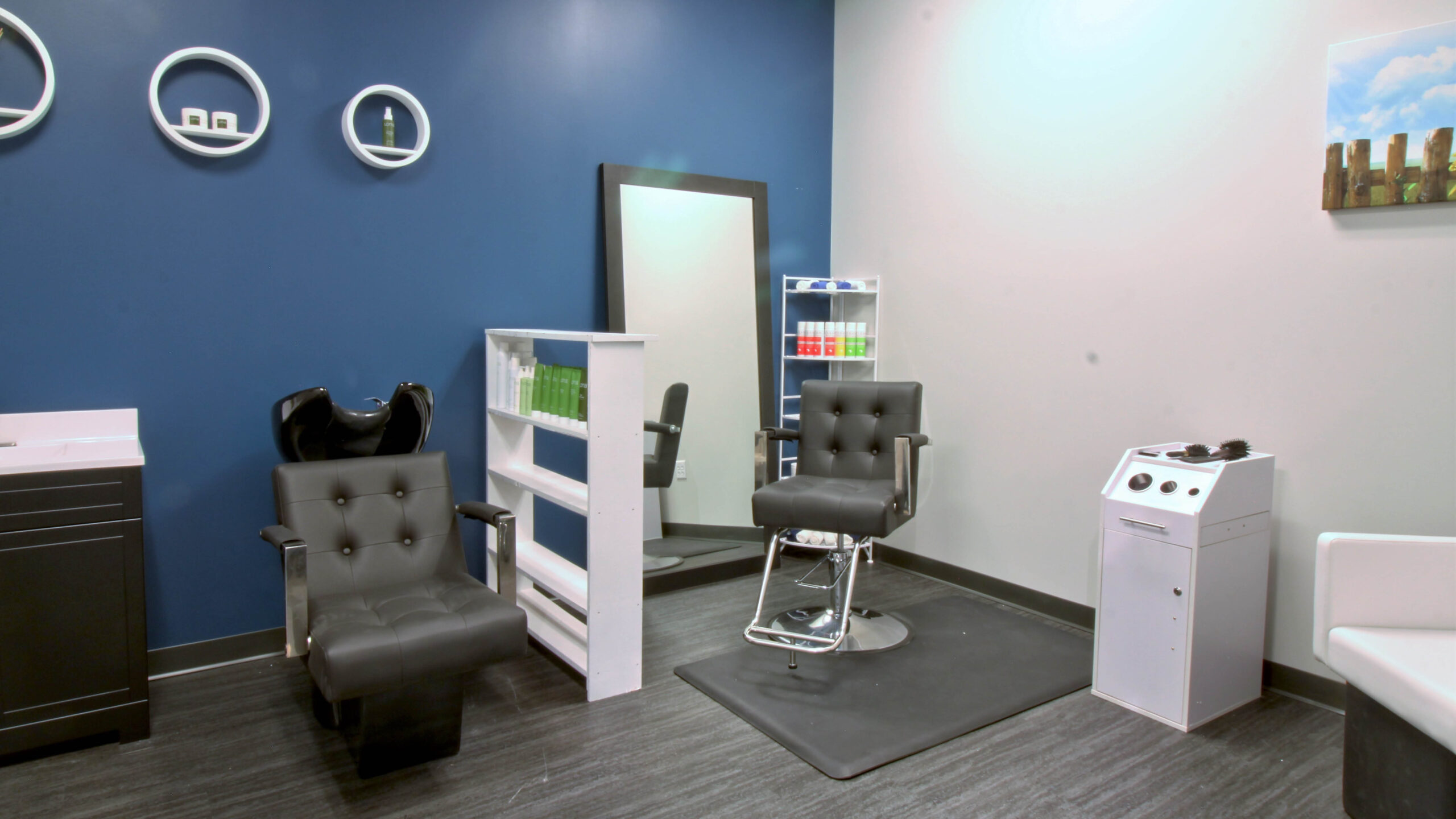 salon space with chair, shelving, and full-length mirror