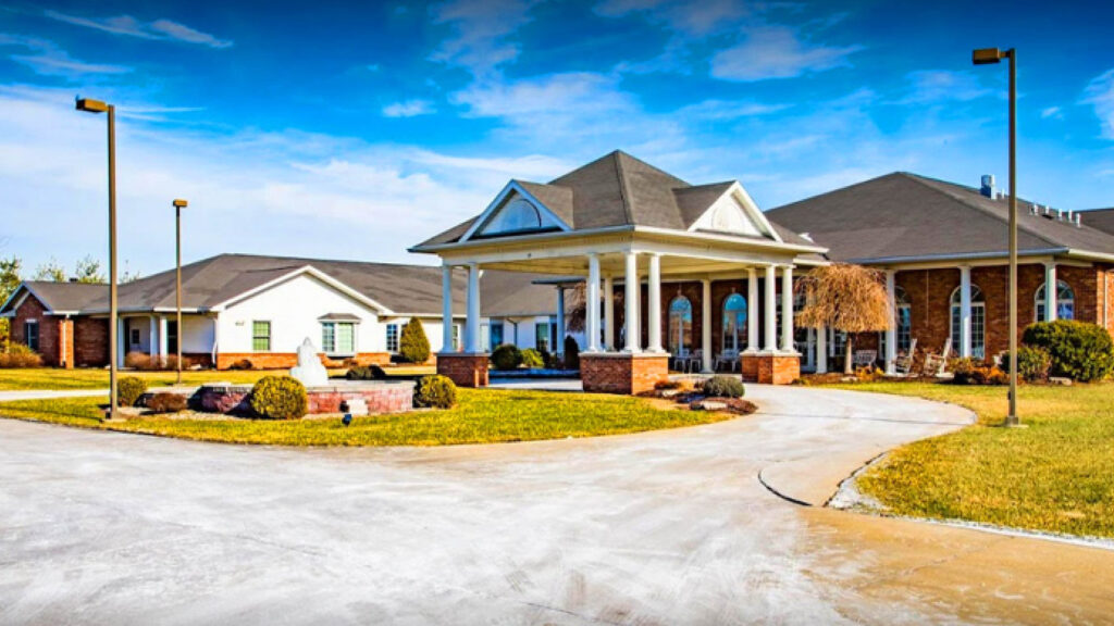 senior living facility with carport and driveway