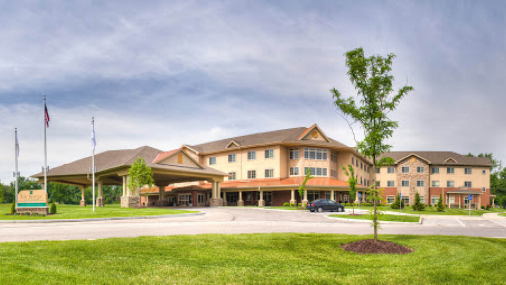 senior living facility with driveway and car port