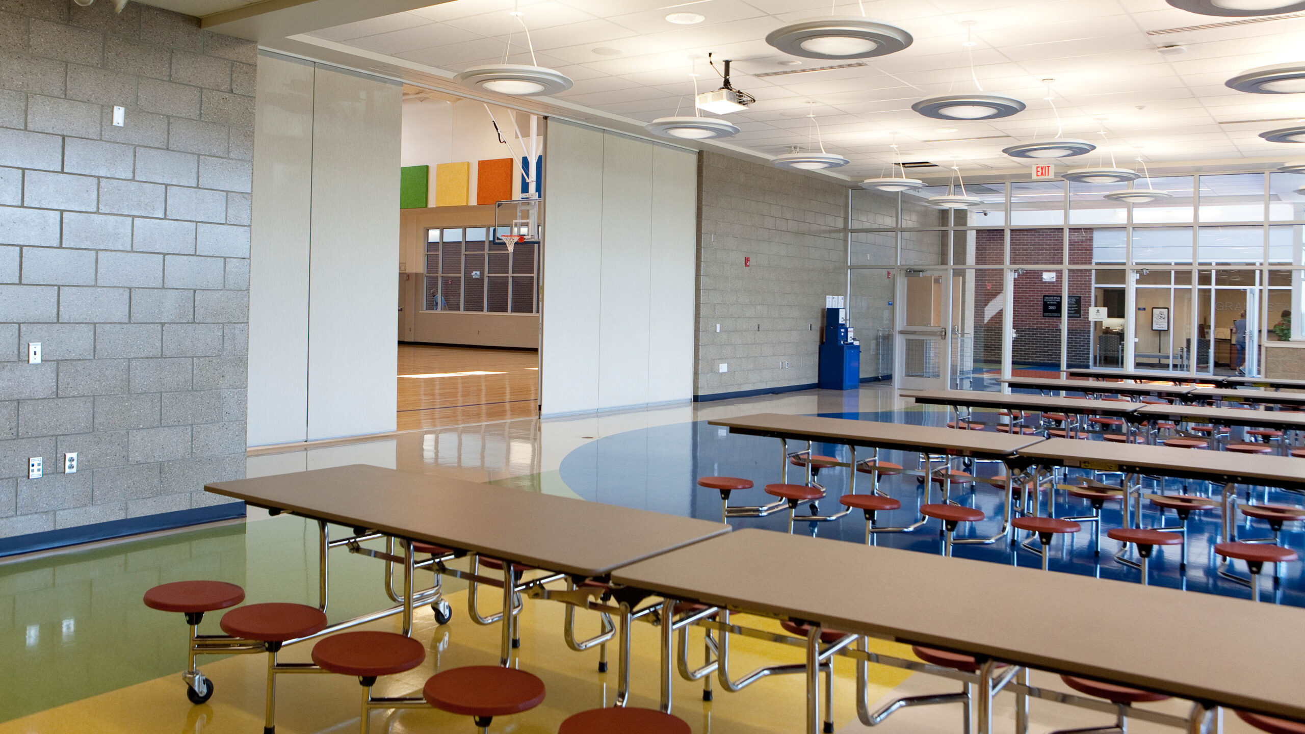 cafeteria with long tables and barstool seating