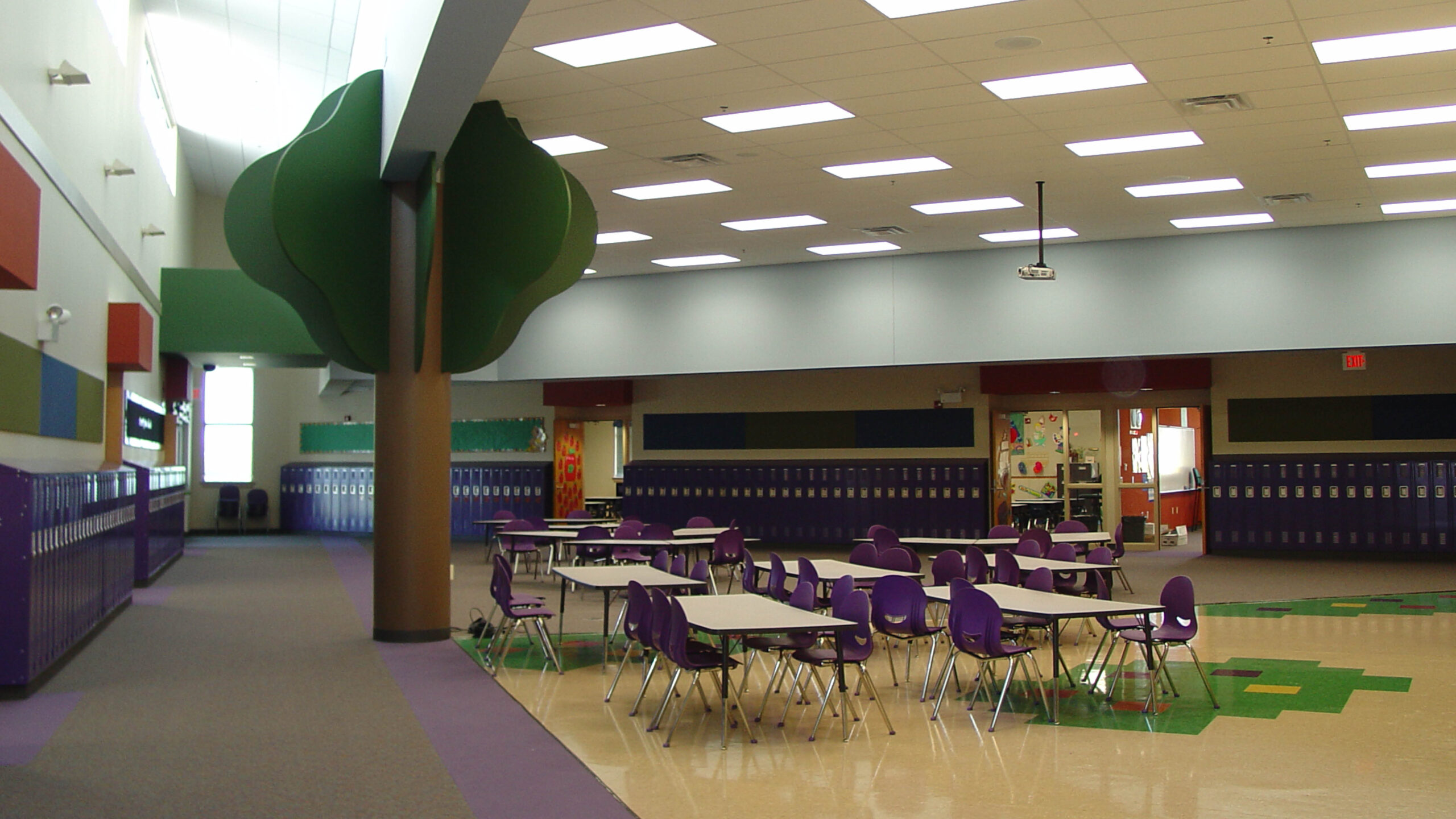cafeteria with long tables and chairs