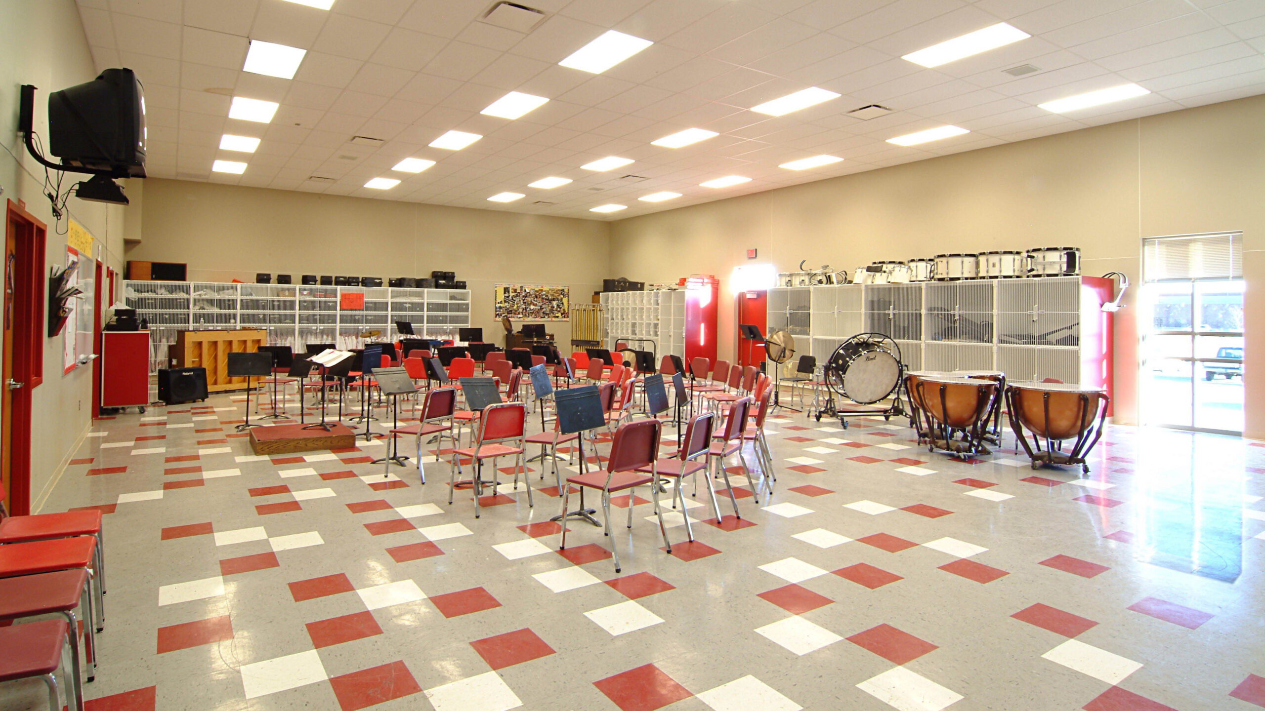 band room with chairs and instruments