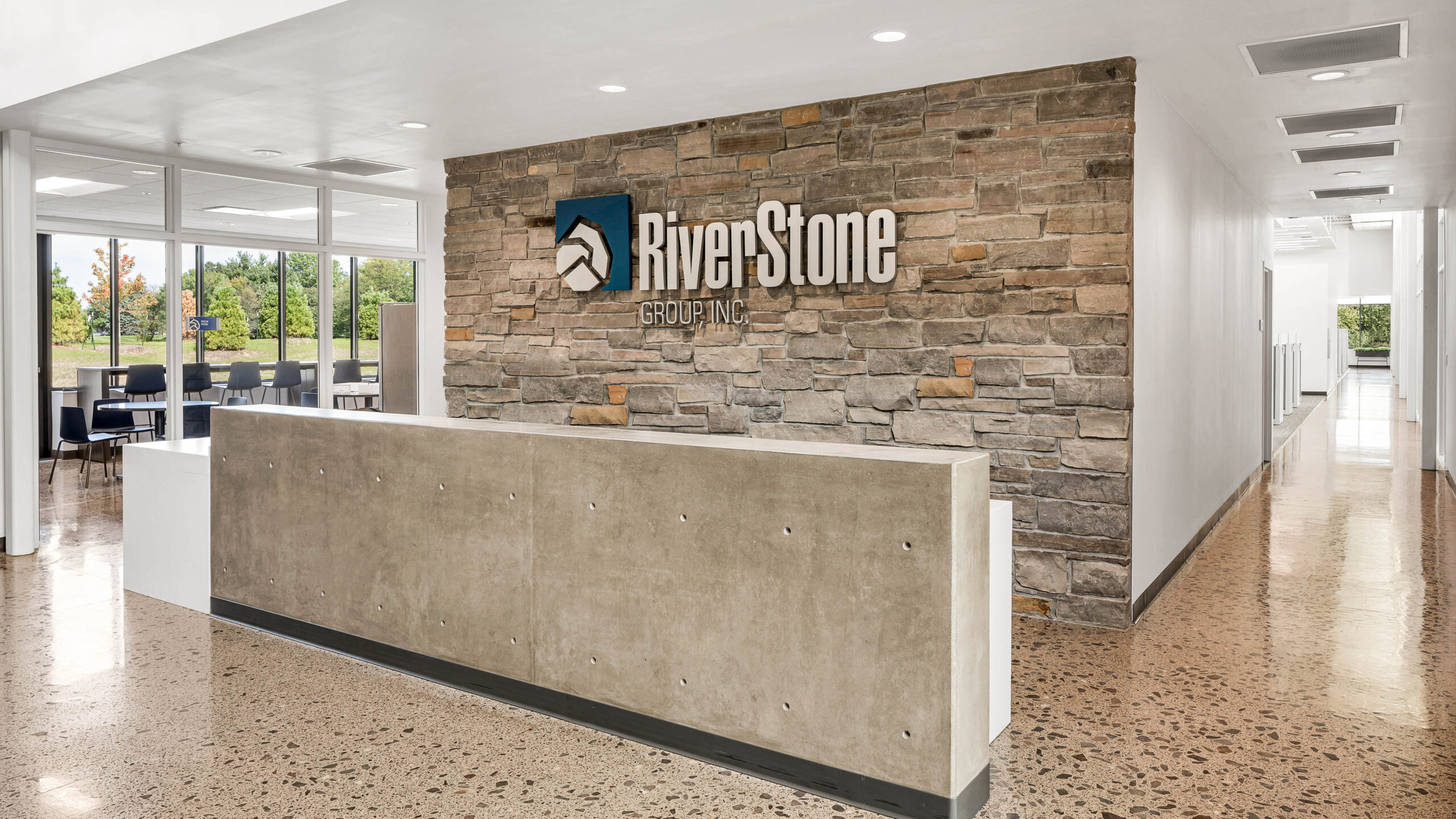 reception desk with logo on a stone wall