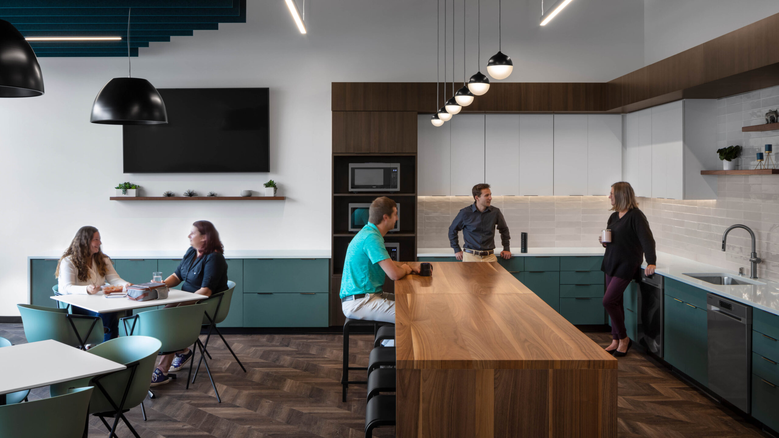 office lounge with cabinets and bar seating