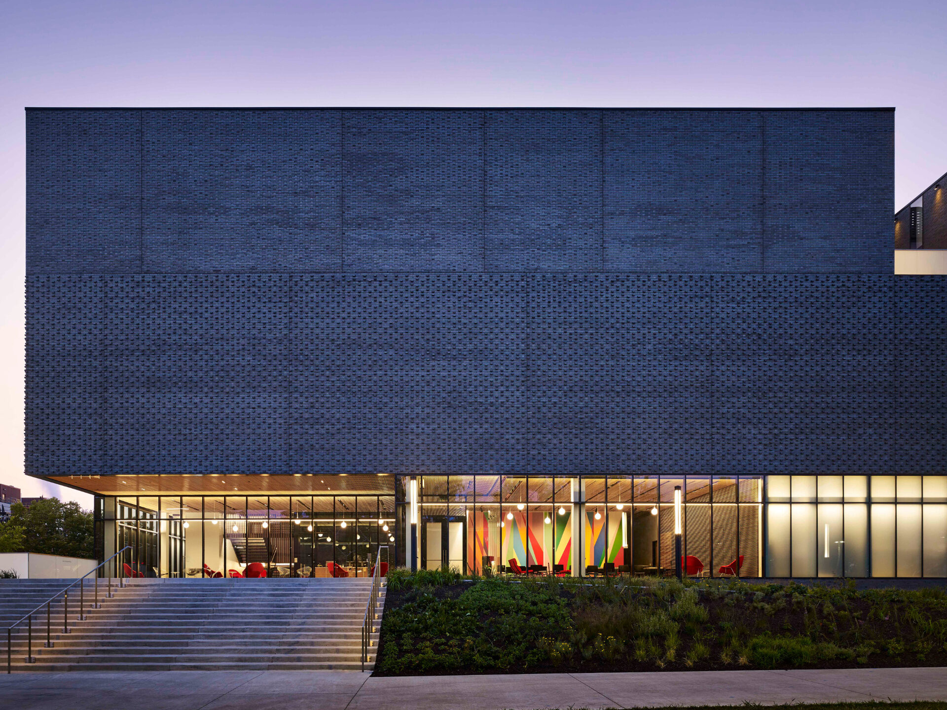 Exterior of the University of Iowa Stanley Museum of Art, a three-story museum with a glass lobby, in Iowa City, Iowa