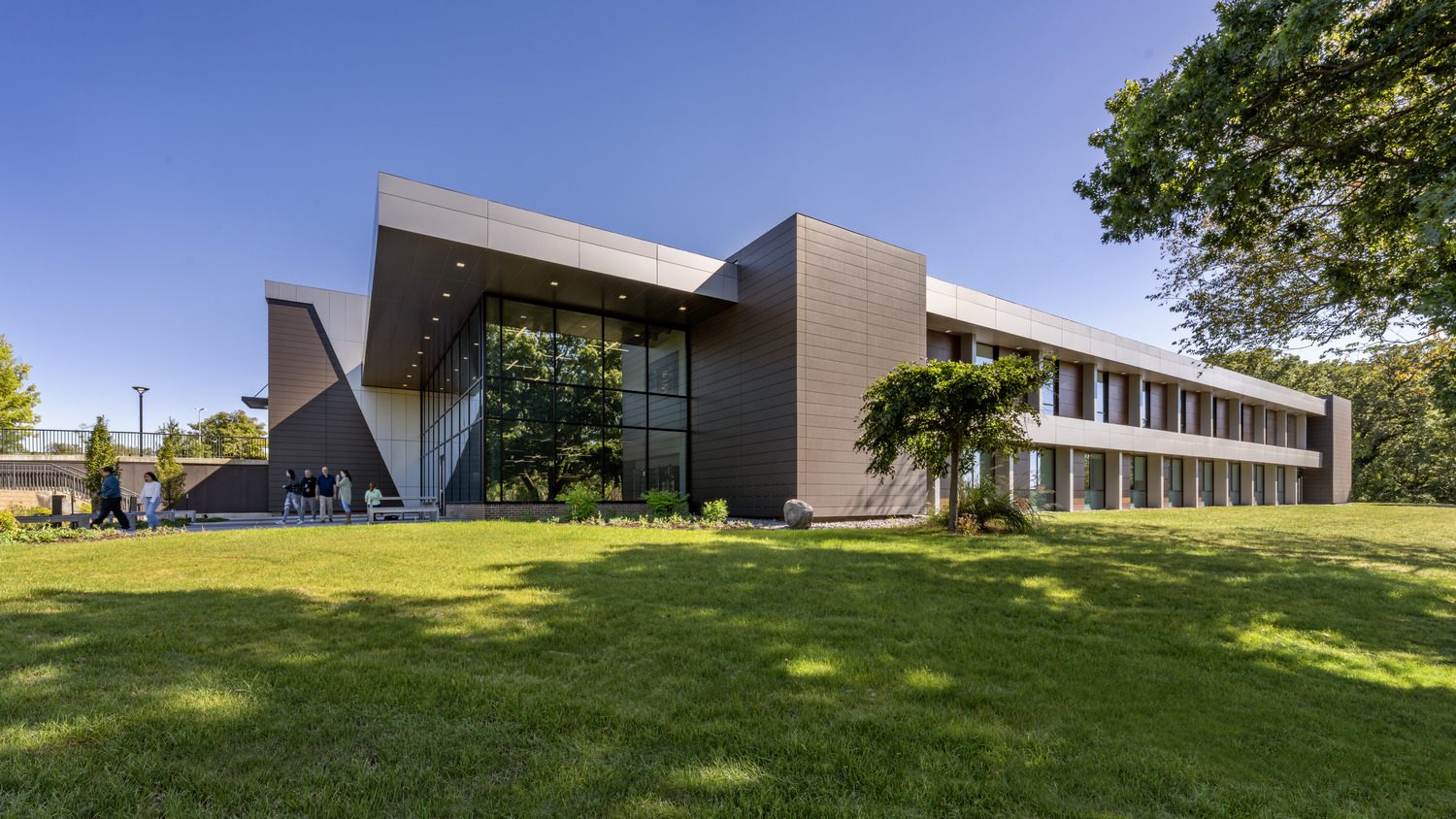 Exterior of Black Hawk College Building 2 in Moline, Illinois, showing the glass entry and two-story academic wing