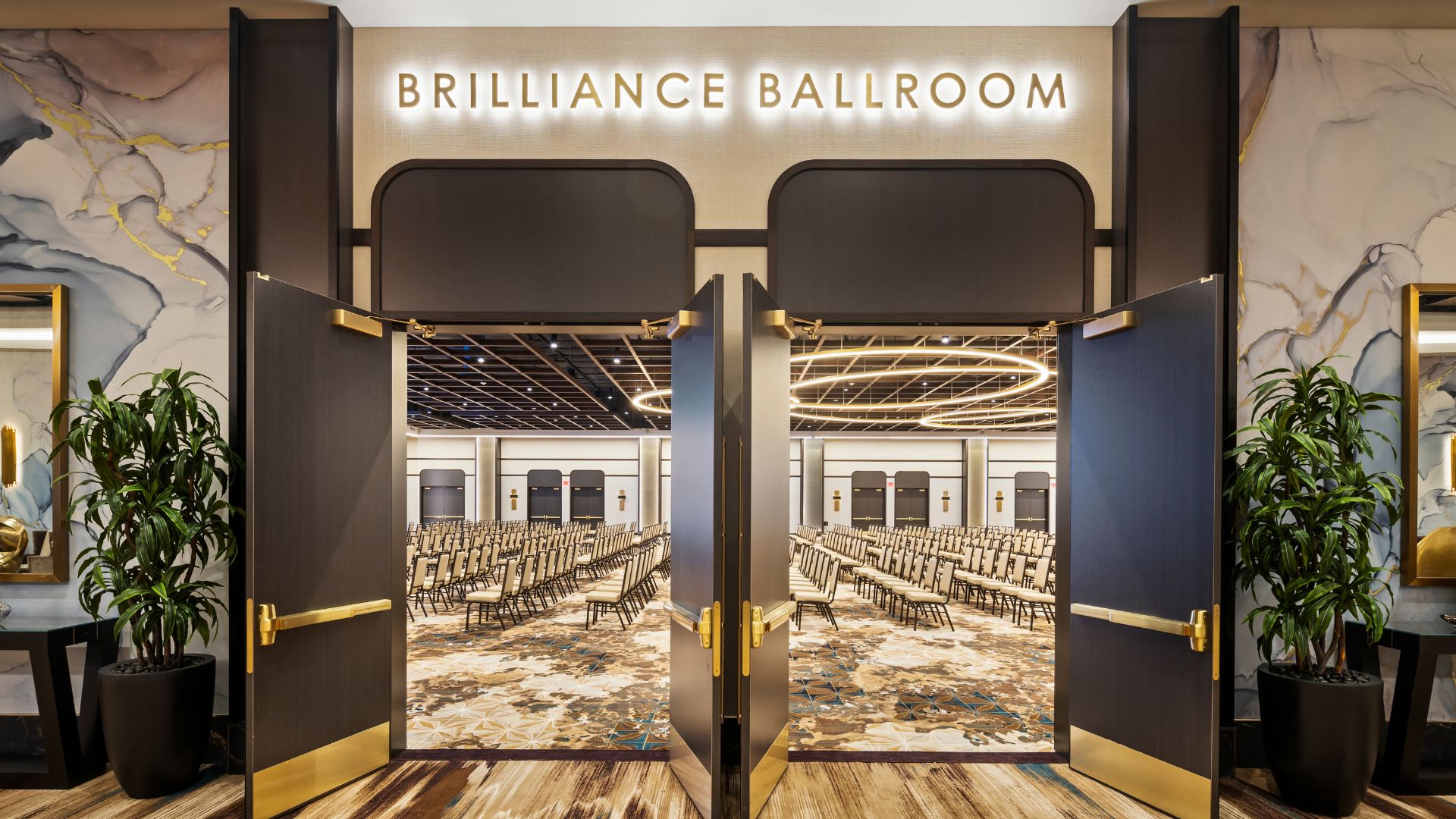 Open doors leading into Brilliance Ballroom set theater style with rows of chairs