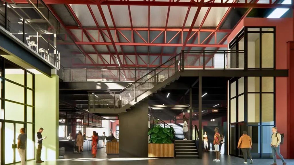 Interior rendering of NewBo City Market in Cedar Rapids showing exposed steel trusses, staircase, and bar and café area