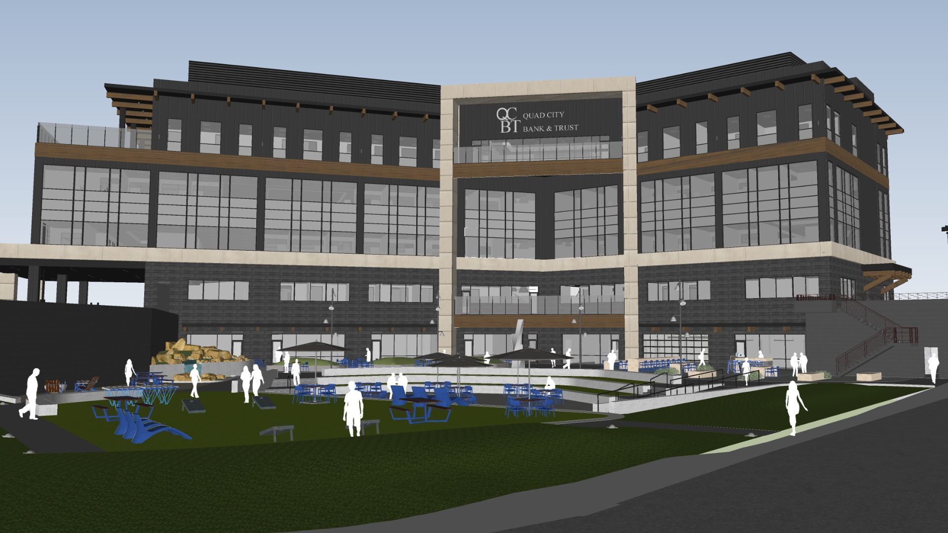 Architectural rendering of the QCR Holdings headquarters courtyard, showing a landscaped outdoor gathering space with lawn games, seating, and umbrella-covered tables in front of the building's glass and stone facade with a Quad City Bank & Trust sign.