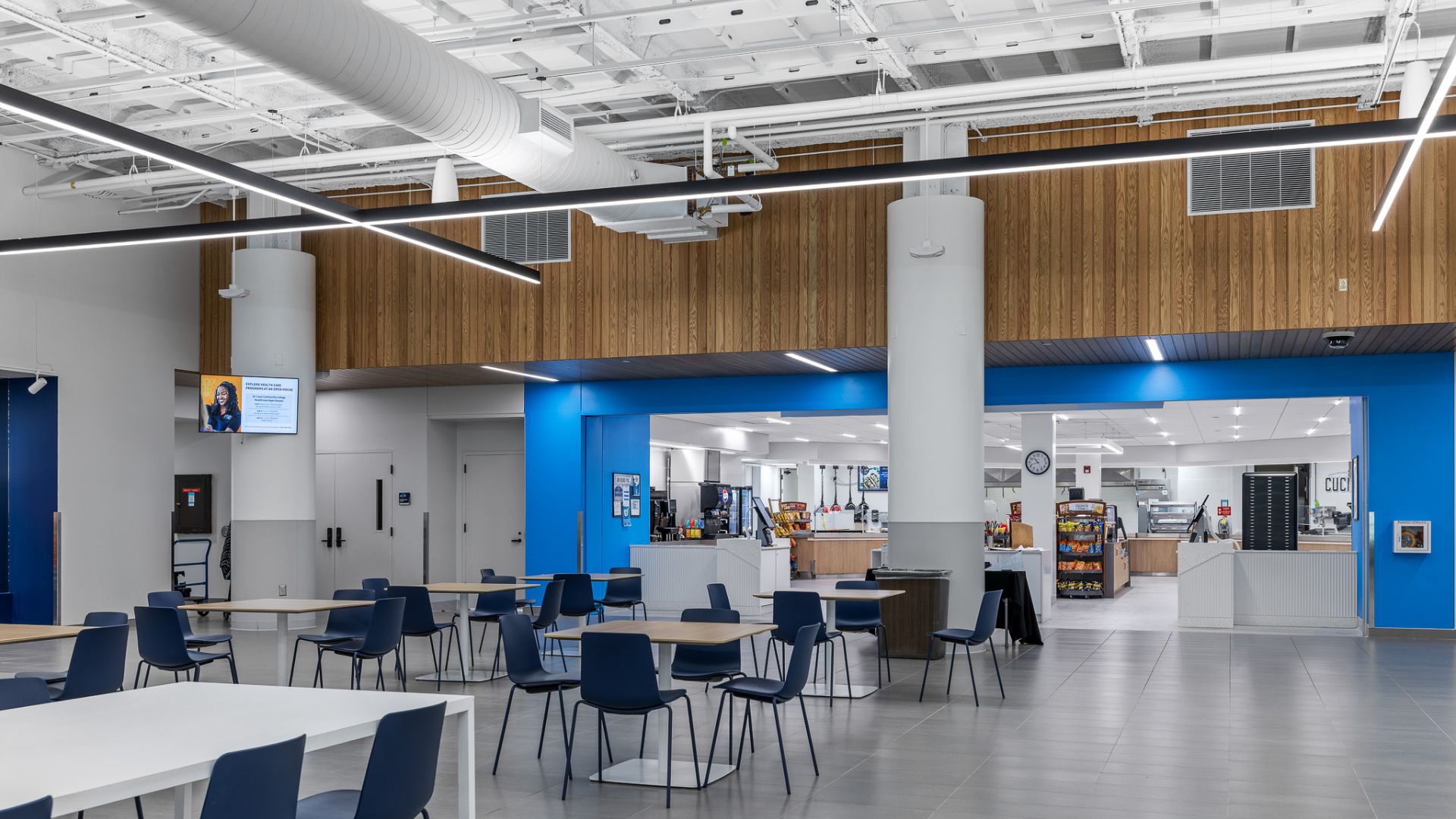 STLCC Meramec Student Center dining hall and servery with wood paneling and blue accent walls