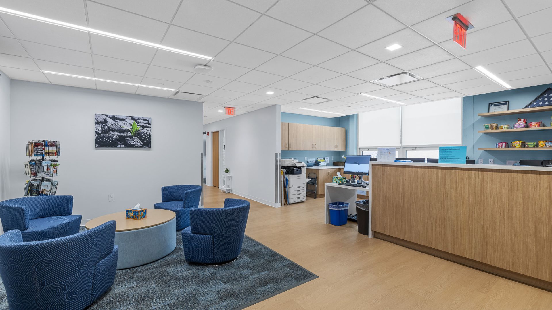 STLCC Meramec Student Center reception area with wood service counter and blue lounge seating