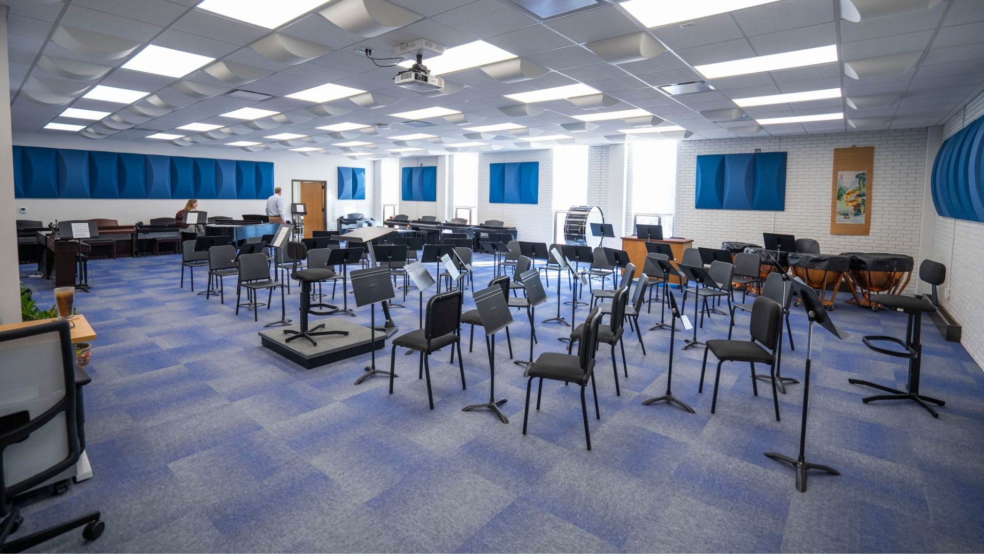 STLCC Florissant Valley music classroom with chairs, music stands, and acoustic wall panels