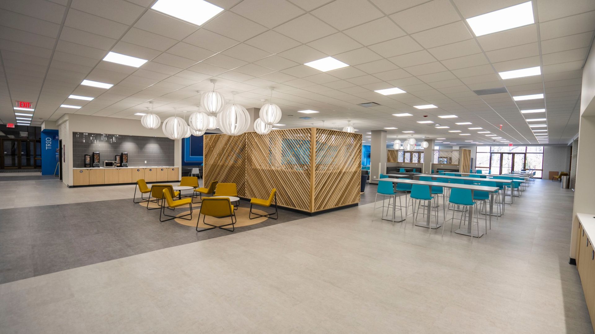 STLCC Florissant Valley dining hall with wood accent partition, pendant lighting, and cafe seating