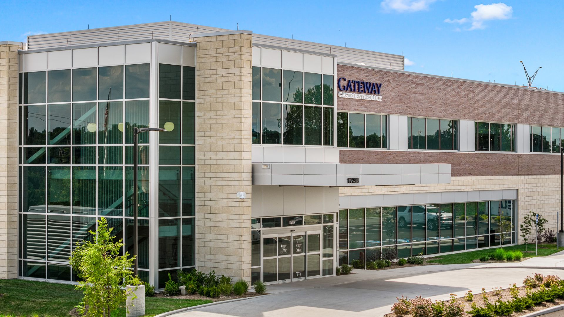 Gateway Gastroenterology building exterior with brick, stone, and glass curtainwall entrance