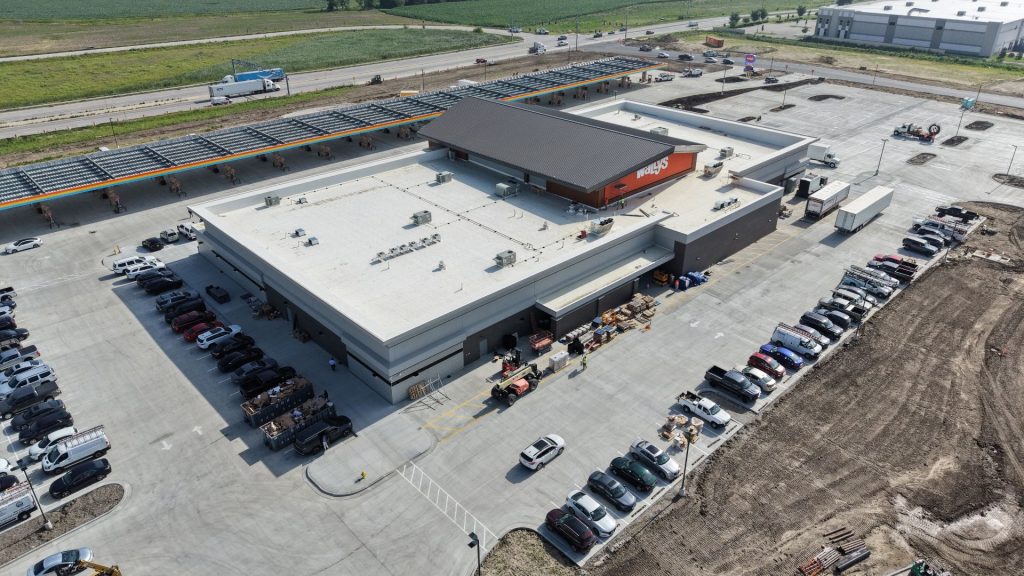 Aerial view of newly built Wally's Travel Center with fuel canopy and parking lot